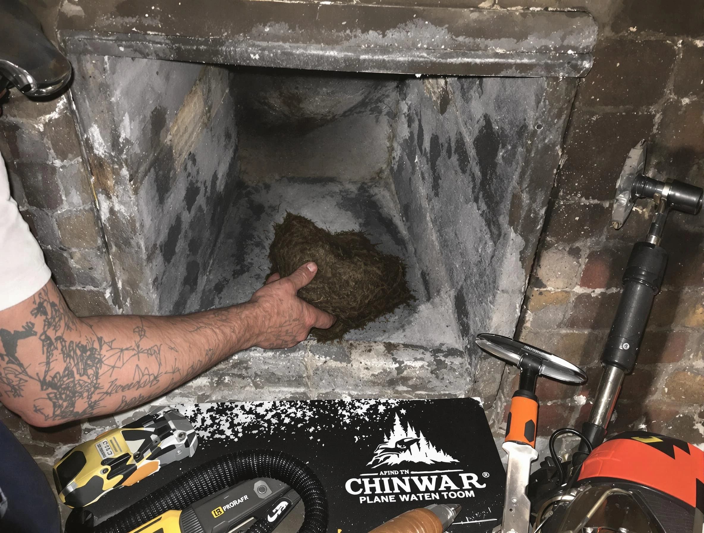 Hendersonville Chimney Sweep safely removing debris and screening chimney in Hendersonville, TN